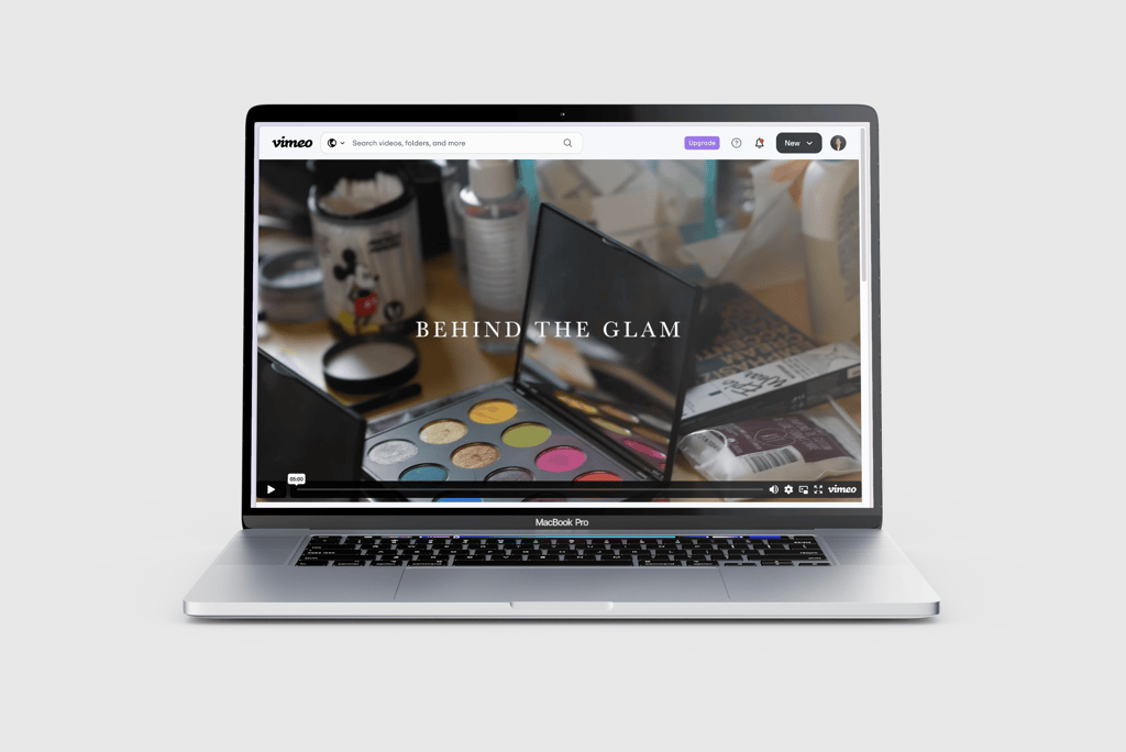 Laptop screen displaying 'Behind the Glam' documentary on Vimeo.