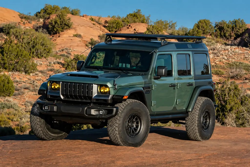 SUV Jeep off-road verde em trilha desértica com pneus para terrenos extremos.