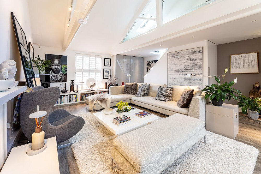 a living room with a couch and a fireplace