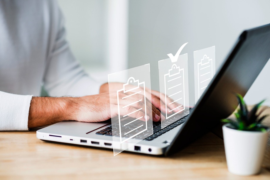 Product Registration UAE person using laptop and tasks layout