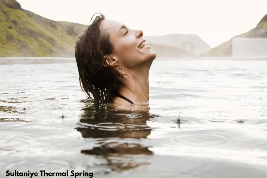 a woman bathing in Sultaniye Thermal Springs, one of the best places to visit in Dalyan