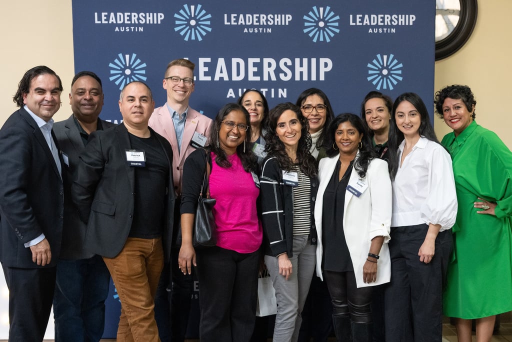 Francisco standing with classmates from Leadership Austin