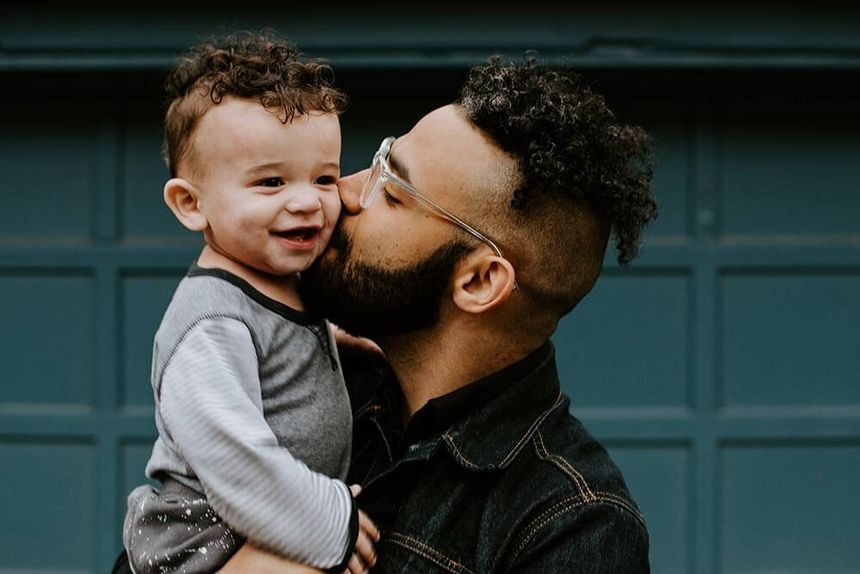 a man with a beard and glasses on his face and happy to show personal loans