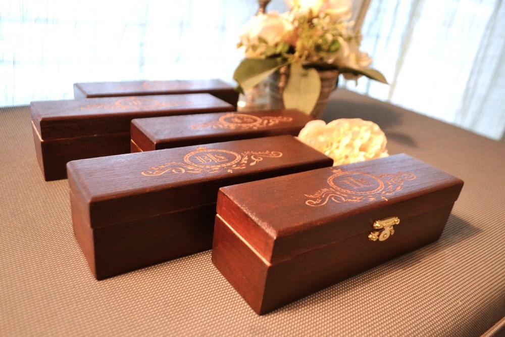 a bunch of wooden boxes with flowers in a vase