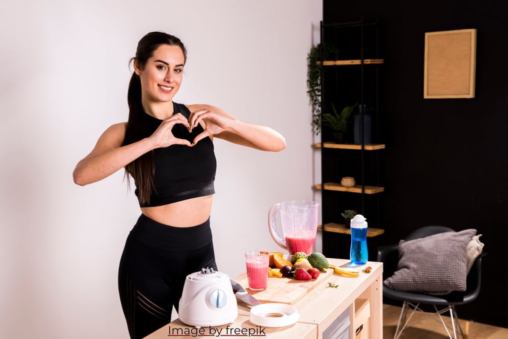 a woman making a heart shape with her hands
