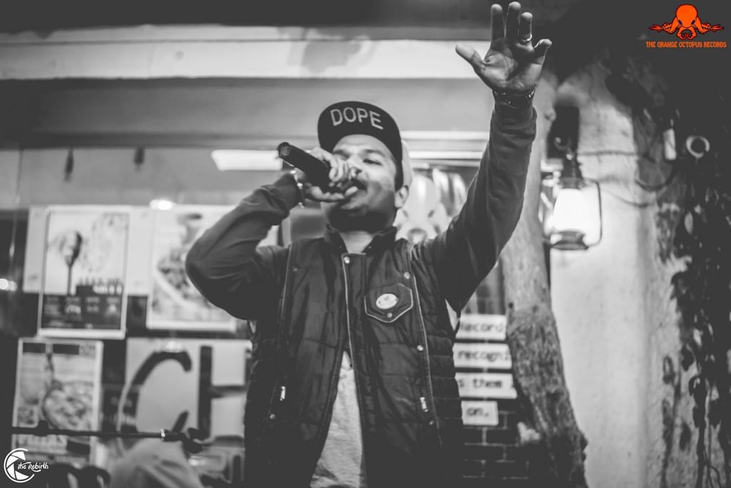 RADA, a rapper performs at an Orange Octopus event in 2017.