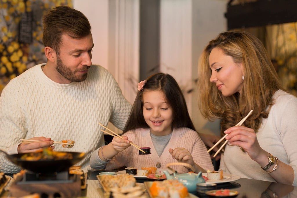 Family eating Sushi