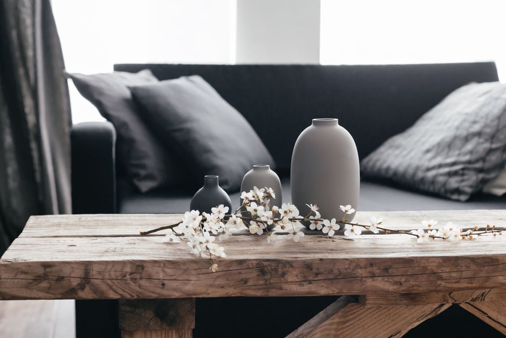 a table with vases and flowers on it