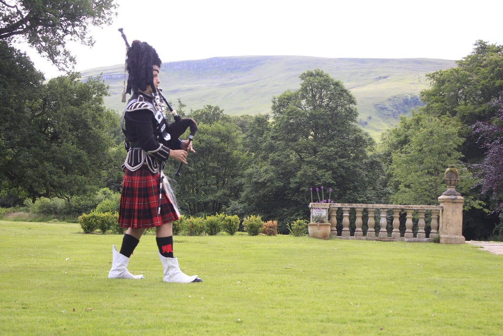 Tony piping for a memorial service at a funeral in Stirlingshire, Scotland. He is wearing the full n