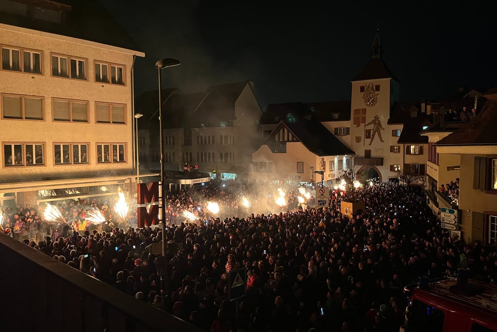 Torches being carried through the center of Liestal Switzerland at Chienbase
