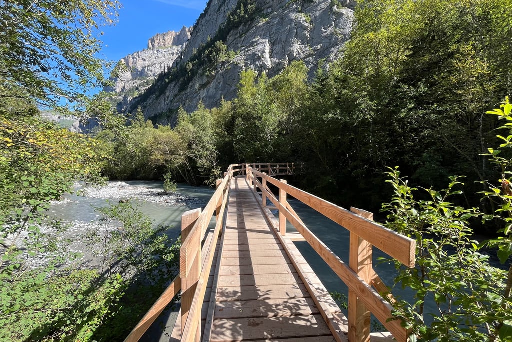 Crossing into the forest of the Gasterntal in Switzerland