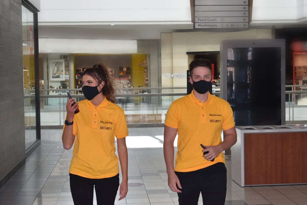 Two Security Guard inside the building inspecting the areas
