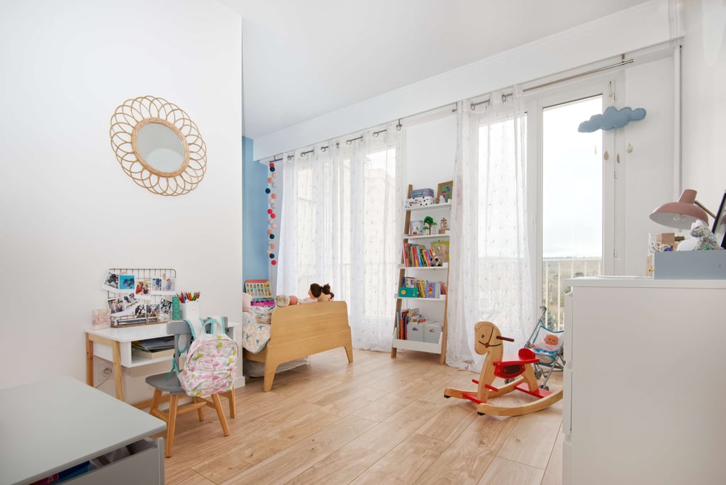 a child's room with a rocking chair and a rocking chair