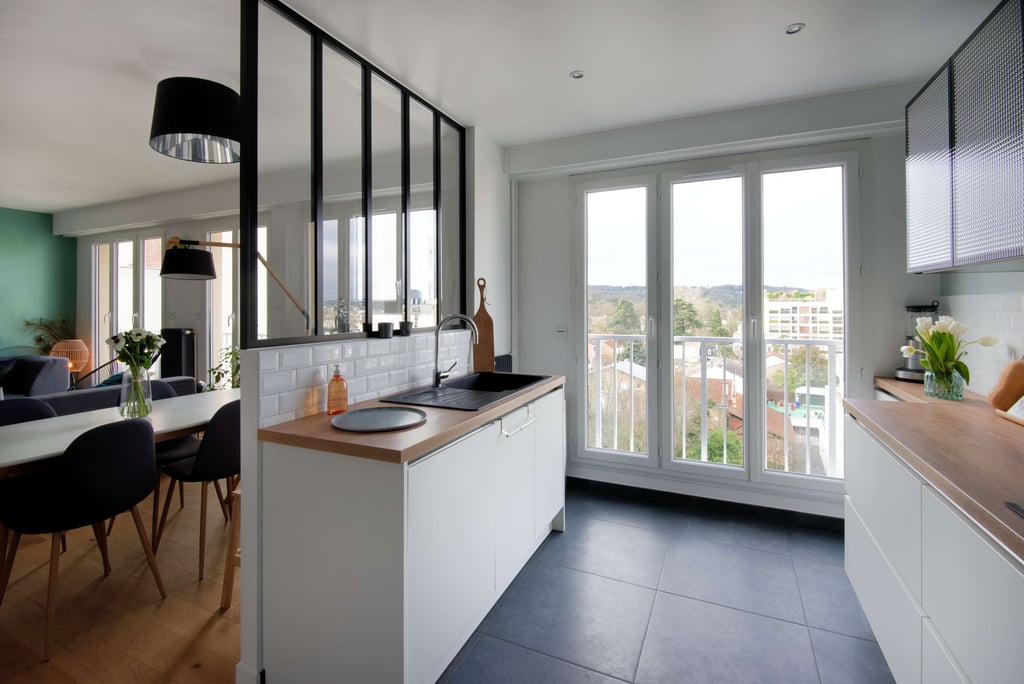 a kitchen with a table and chairs and a table