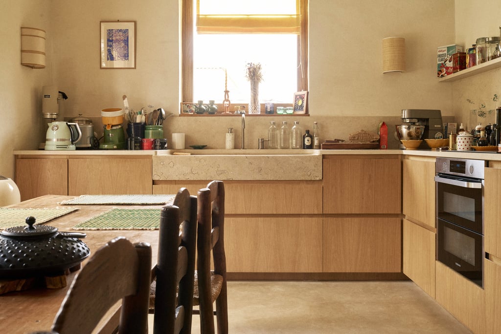 a kitchen with a table and chairs and a stove