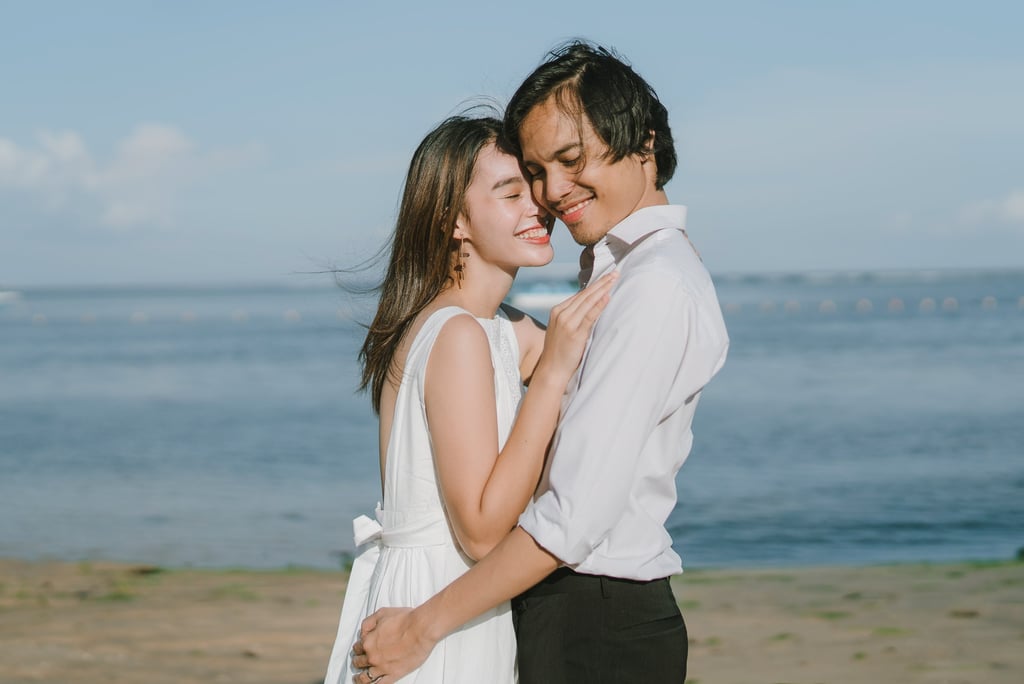 Romantic couple portrait by the sea at Novotel Bali Benoa in Tanjung Benoa Bali.