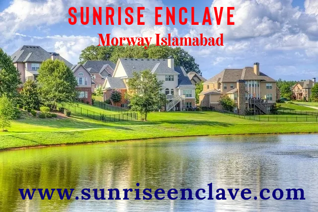 a lake with houses and a sky view of the sun