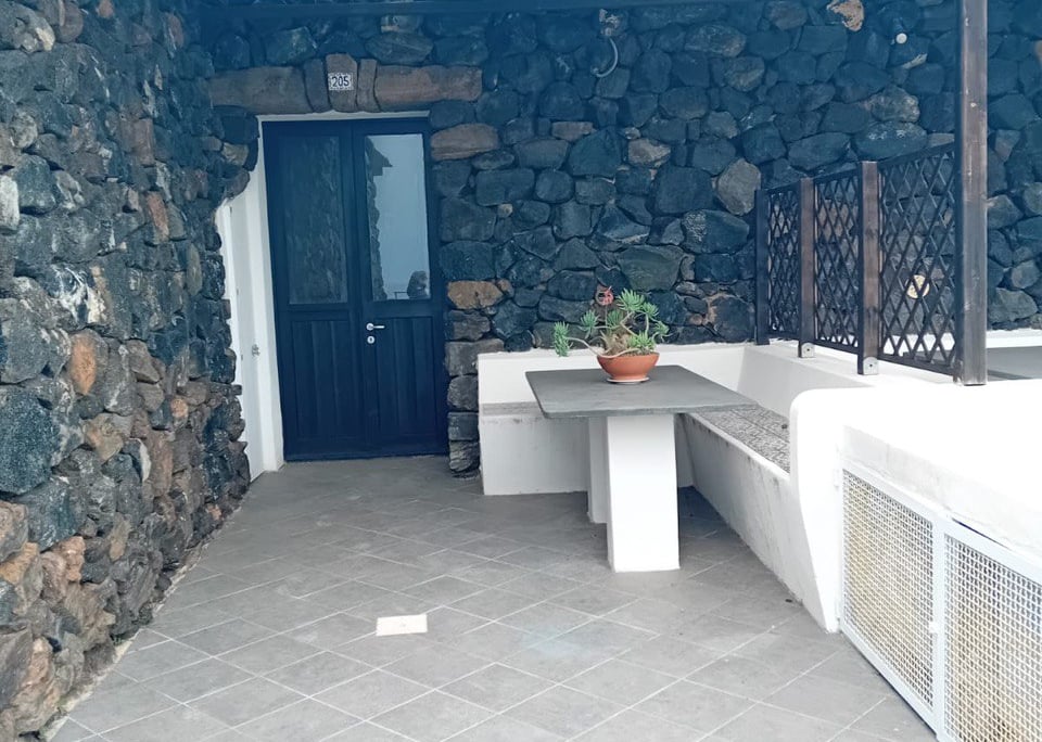 Dammuso in Sataria with stone walls near the Sataria caves