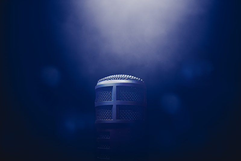 a microphone with a microphone in the background