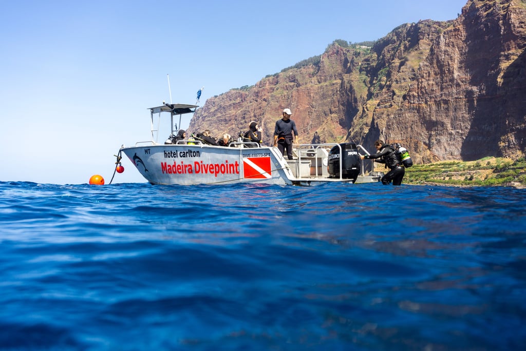 Dive Boat in front of cabo Girao Cliff