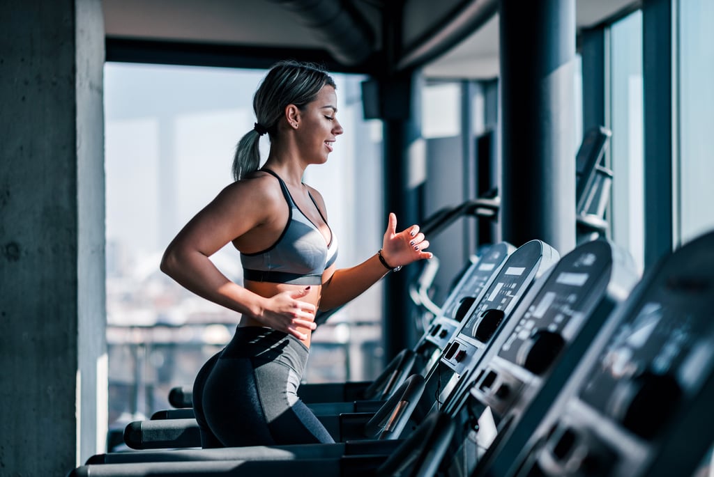 Girl Doing fitness on treadmill