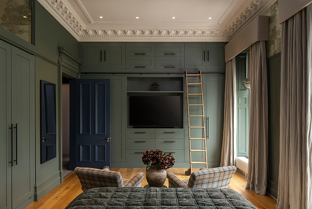 a bedroom with a ladder to climb up to the bed