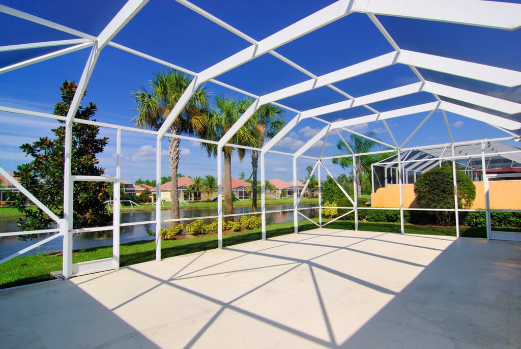 St Petersburg concrete pool deck and patio installation with screened lanai