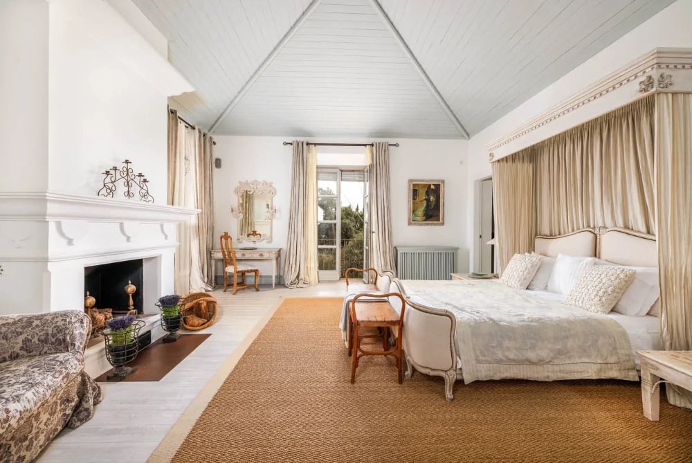 Master suite with fireplace at Finca Santa Katerina