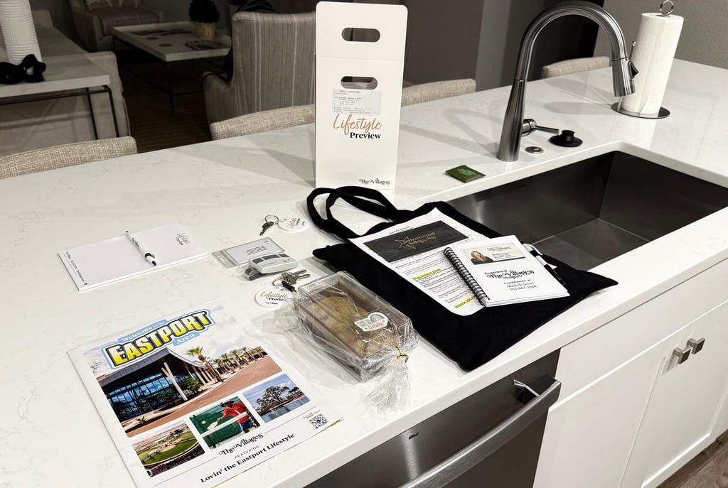 Lifestyle Preview welcome materials, keys, and maps displayed on the kitchen island at The Villages