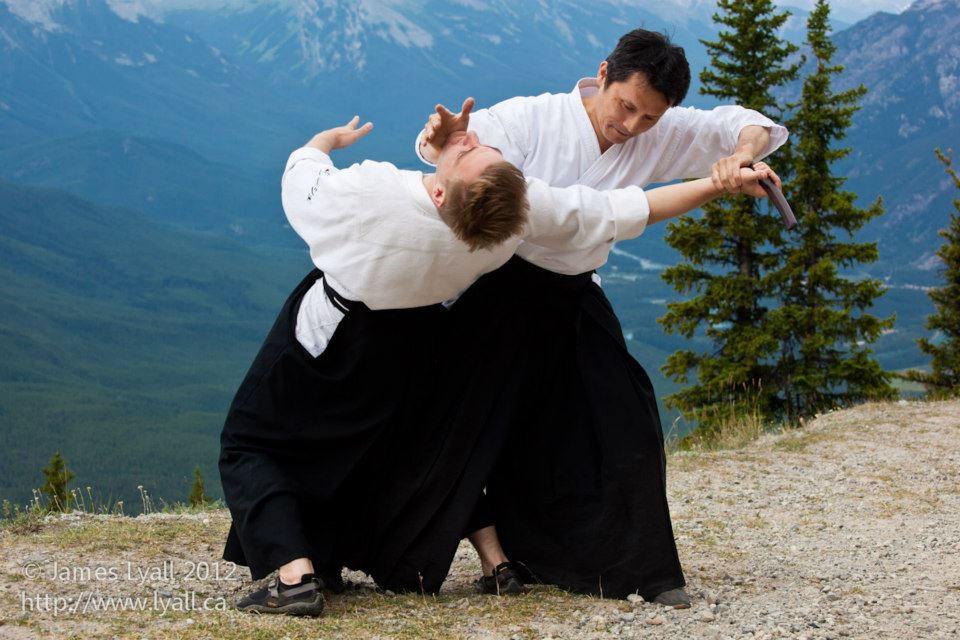 Ishikawa sensei and sjoh practicing traditional martial arts in alberta