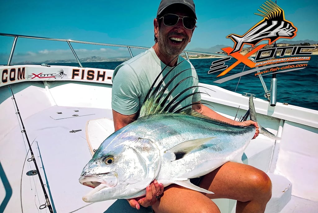 a man holding a fish on a boat