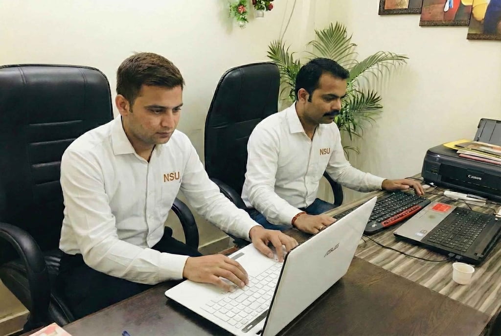 NSU India computer data operators managing visitor records and real-time CCTV surveillance reporting