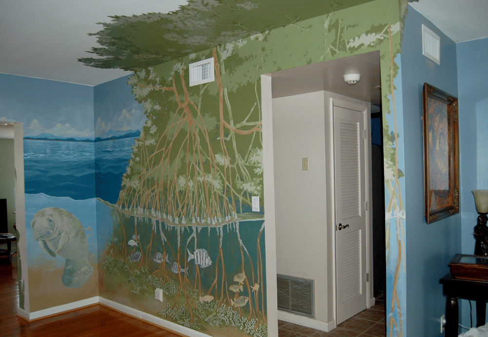 Interior mural of a manatee, with mangroves, skyline, and saltwater fish.