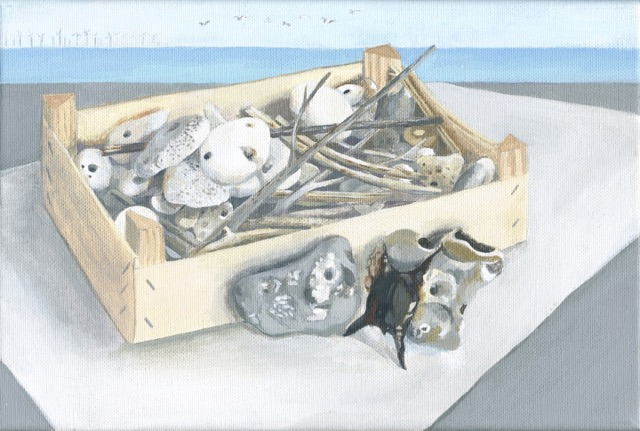 wooden box of stones and twigs