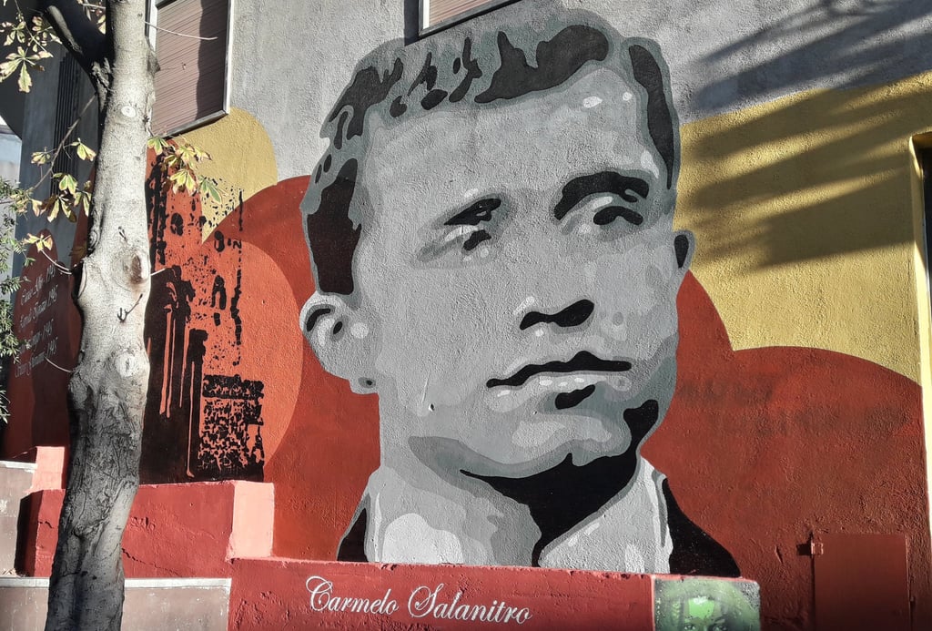 Mural dedicated to Carmelo Salanitro, created by Poliops on an urban wall, a historical commemorativ