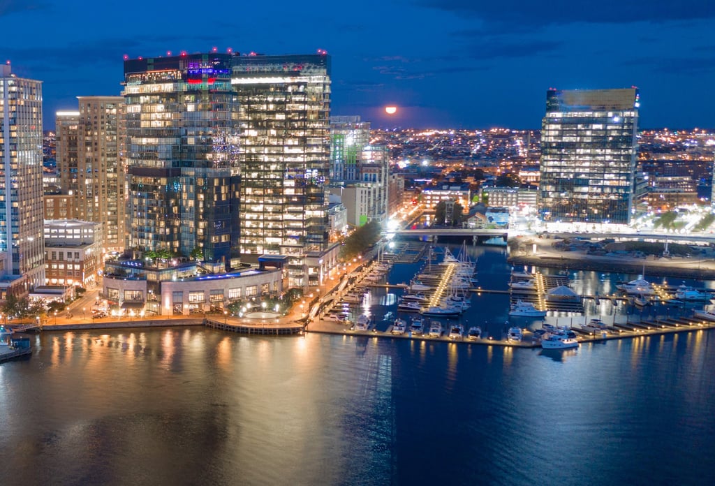 The buildings are illuminated in the downtown urban core of Baltimore Maryland