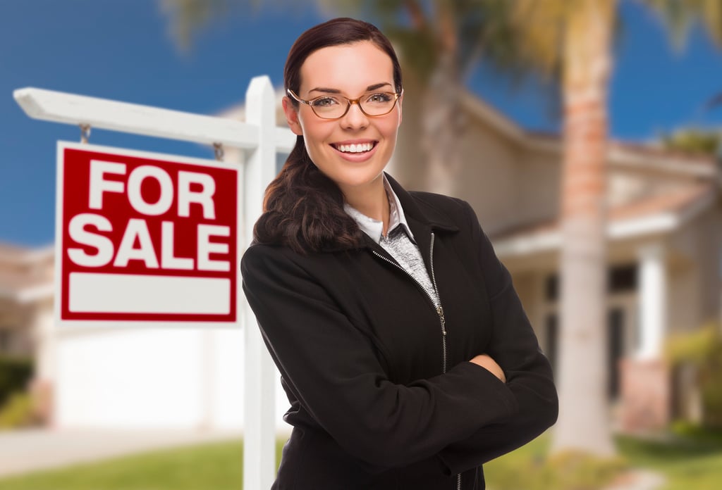 Real Estate and For Sale Sign and House on Background