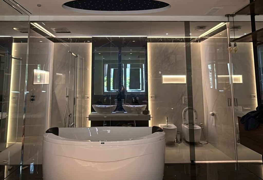 a bathroom with a large tub and a large tub