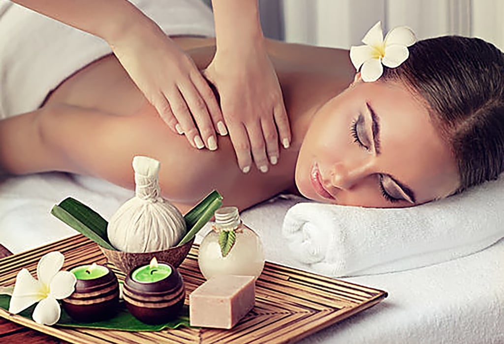 a woman getting a massage at a spa