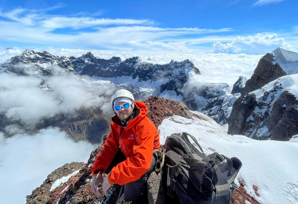 climber on top of El Altar Obispo