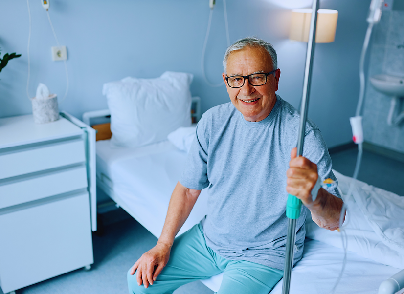 Elderly man receiving IV energy boosting therapy to improve his strength and vitality. Advanced hydr