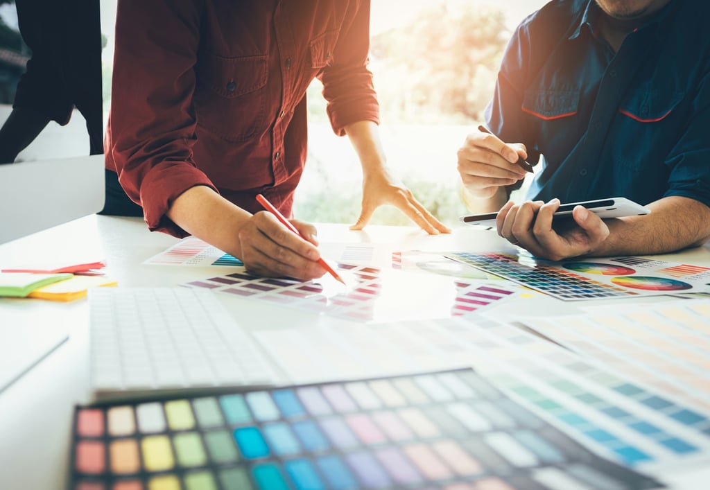 Designers working with color palettes
