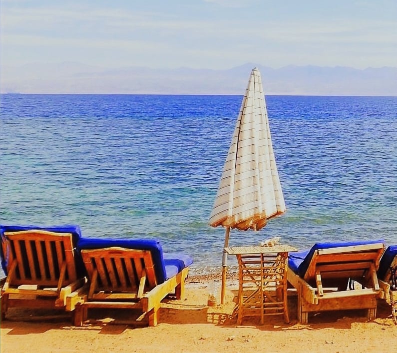 Relaxing in front of the sea on our chaise lounge