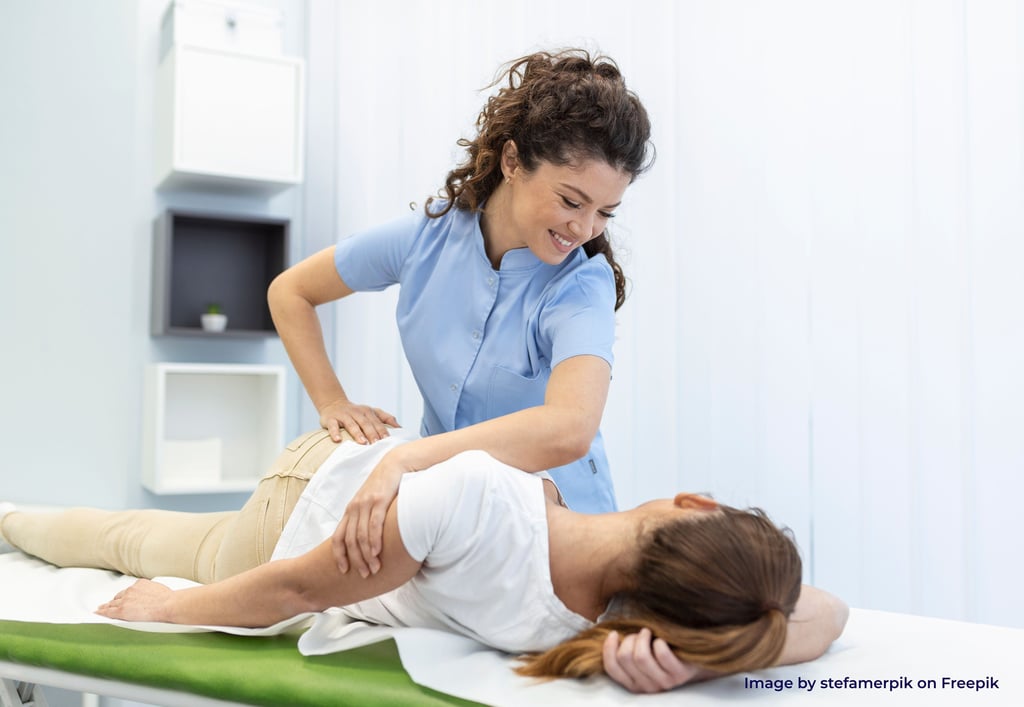 a woman treating patient through chiropractic