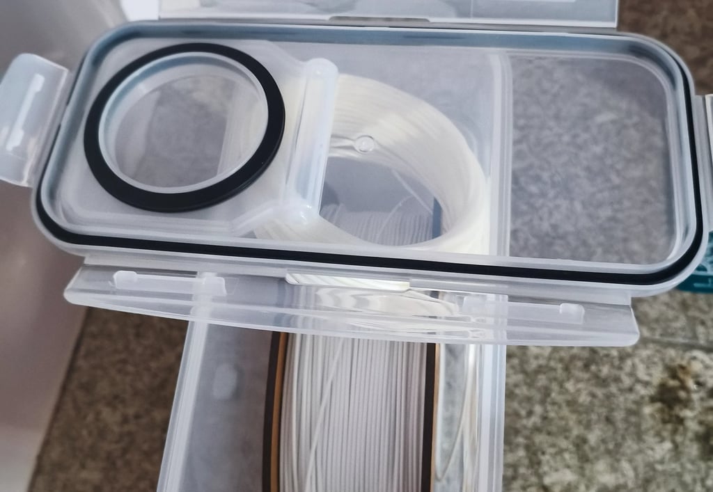 Caixa com sistema de vácuo para armazenamento de filamento de impressão 3D