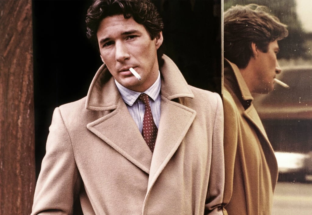 Richard Gere in American Gigolo (1980) wearing a Giorgio Armani camel coat.