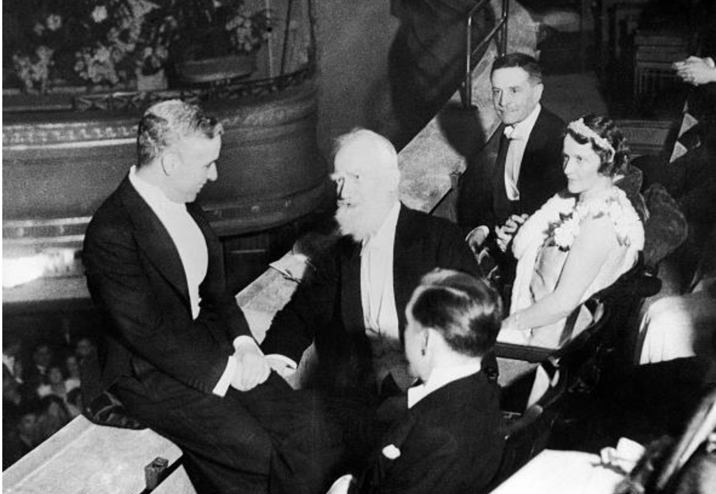 Nancy Astor seated at the 1931 City Lights premiere with Charlie Chaplin and George Bernard Shaw.