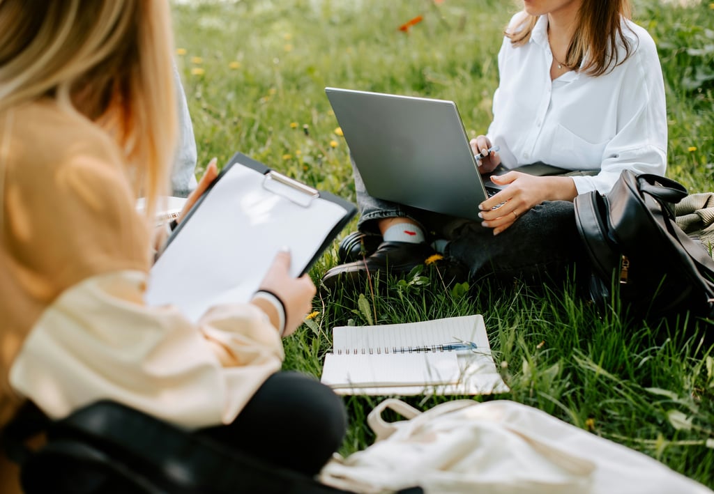 Pure Mathematics Online Tutoring students studying whilst sitting in the grass