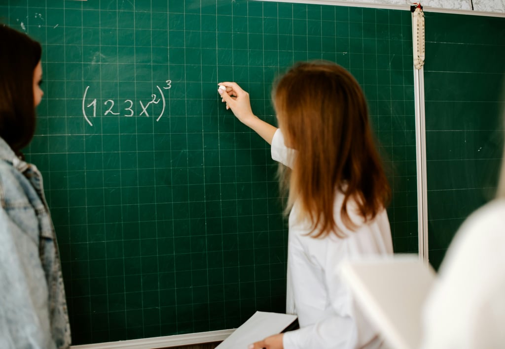 A Level Maths Online Tutor with an A Level Maths students solving questions