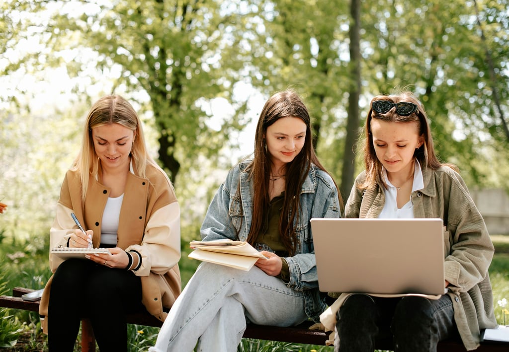 A Level Maths Online Tutoring students learn A Level Maths in Nature sitting on a bench